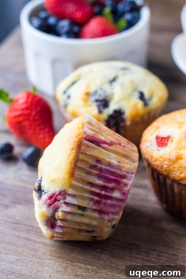 Summer Berry Burst Muffins 3 Triple Berry Muffins. Moist, fluffy, buttery & bursting with berries - make them with fresh or frozen fruit - they're always a hit! www.justsotasty.com