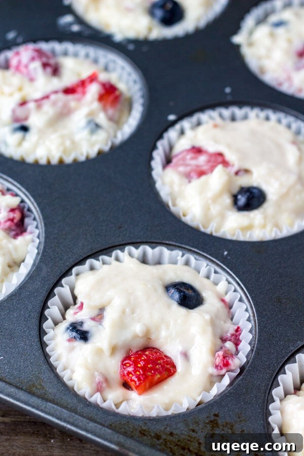 Summer Berry Burst Muffins 5 Triple Berry Muffins. Moist, fluffy, buttery & bursting with berries - make them with fresh or frozen fruit - they're always a hit! www.justsotasty.com