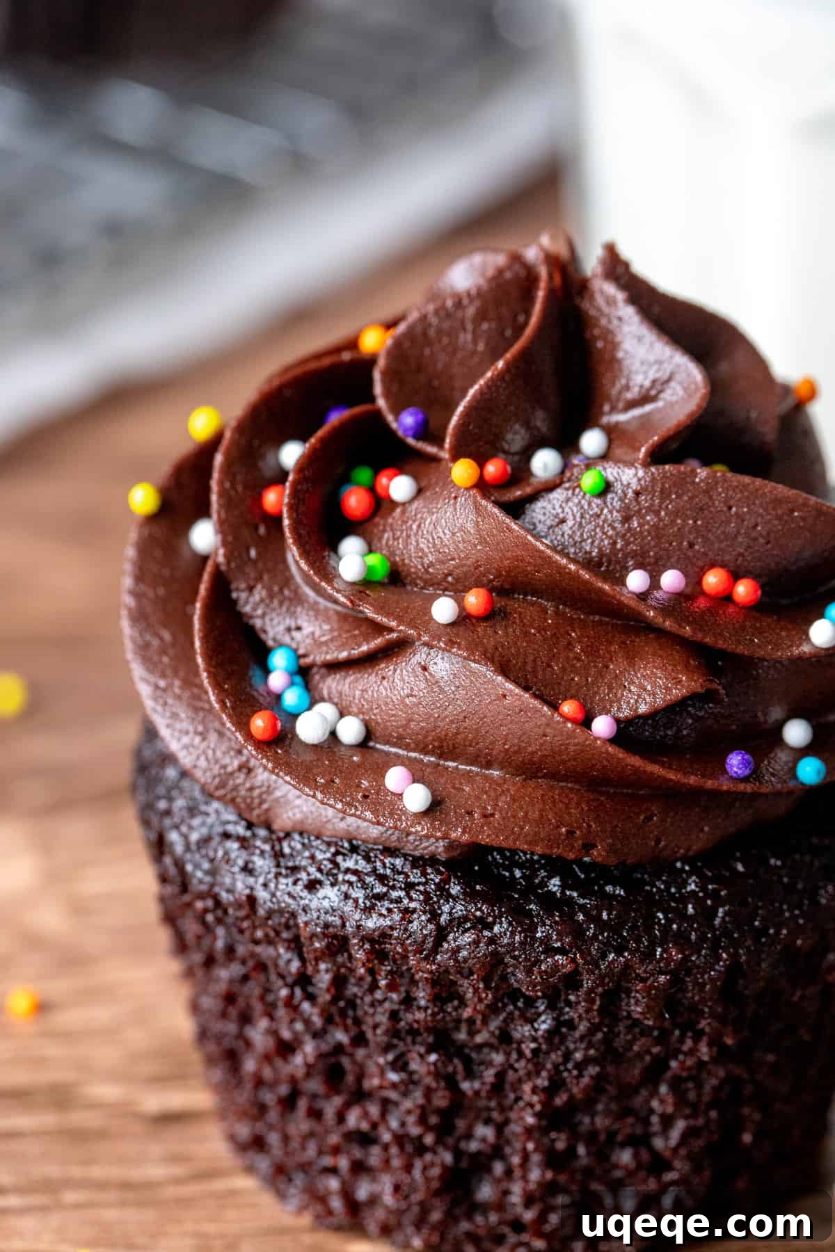 Pure Double Chocolate Indulgence 2 Moist chocolate cupcake with rich chocolate frosting, ready to be enjoyed