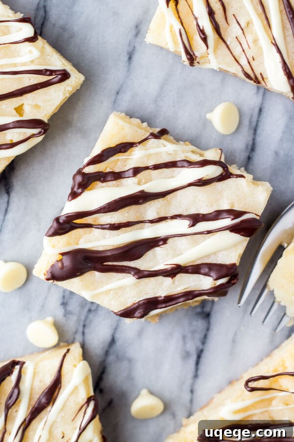 Velvet White Chocolate Squares 3 Close-up of Gooey White Chocolate Brownies, perfect for a decadent treat.