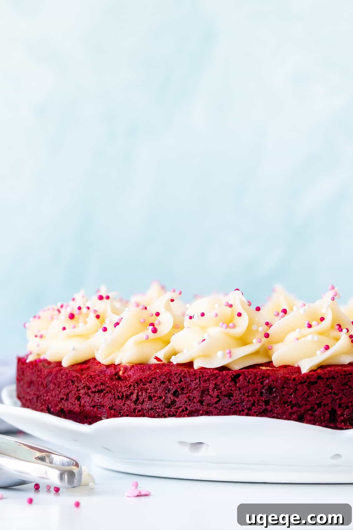 Decadent Red Velvet Cookie Cake 6 9-inch round red velvet cookie cake decorated with rosettes of cream cheese frosting