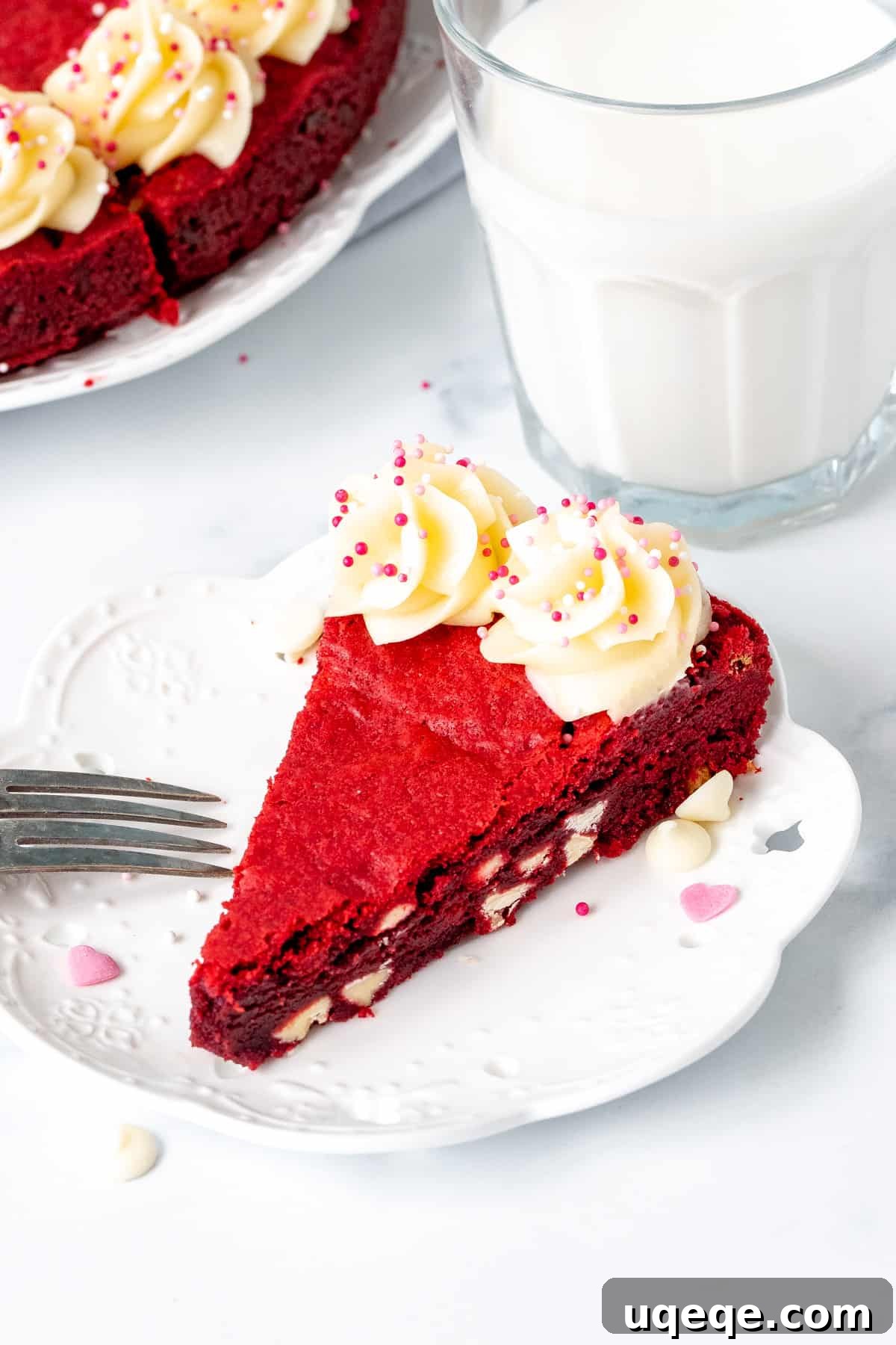 Decadent Red Velvet Cookie Cake 7 Slice of white chocolate chip red velvet cookie cake with glass of milk
