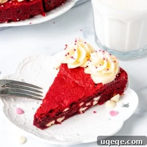 Slice of giant red velvet cookie with cream cheese icing