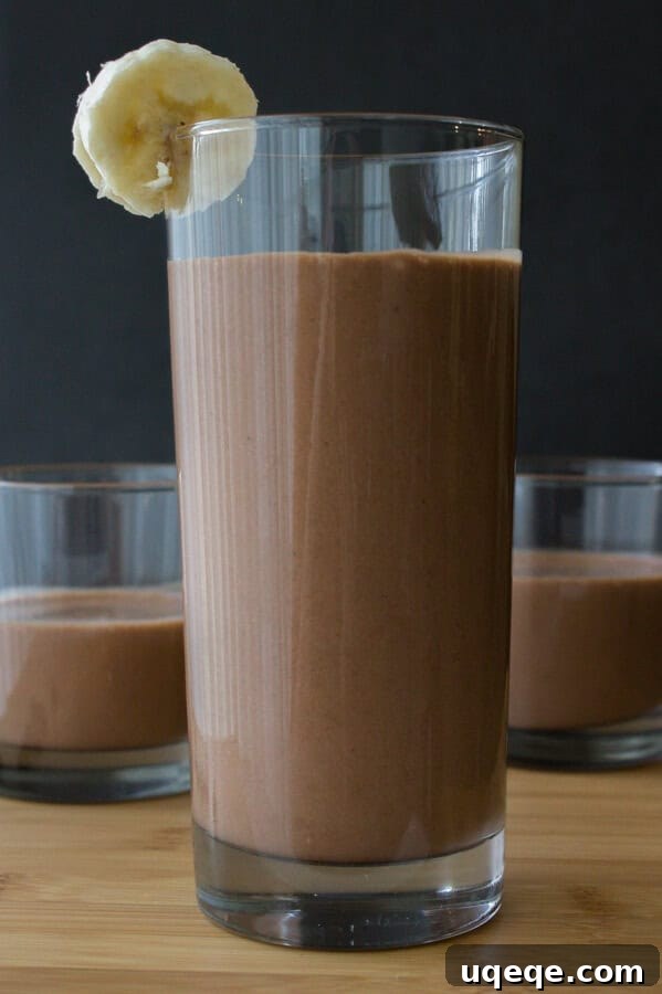 Decadent Chocolate Peanut Butter Banana Delight 4 Top-down view of a Chocolate Peanut Butter Banana Smoothie garnished with a banana slice, a perfect diet-approved treat