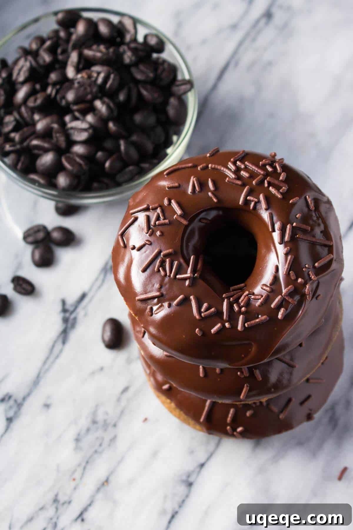 A delicious, coffee-flavored cake doughnut dipped in fudgy, chocolate glaze. These super easy Baked Mocha Doughnuts are the best way to get your morning caffeine fix! www.justsotasty.com