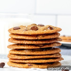 Thin chocolate chip cookies, stacked on top of each other