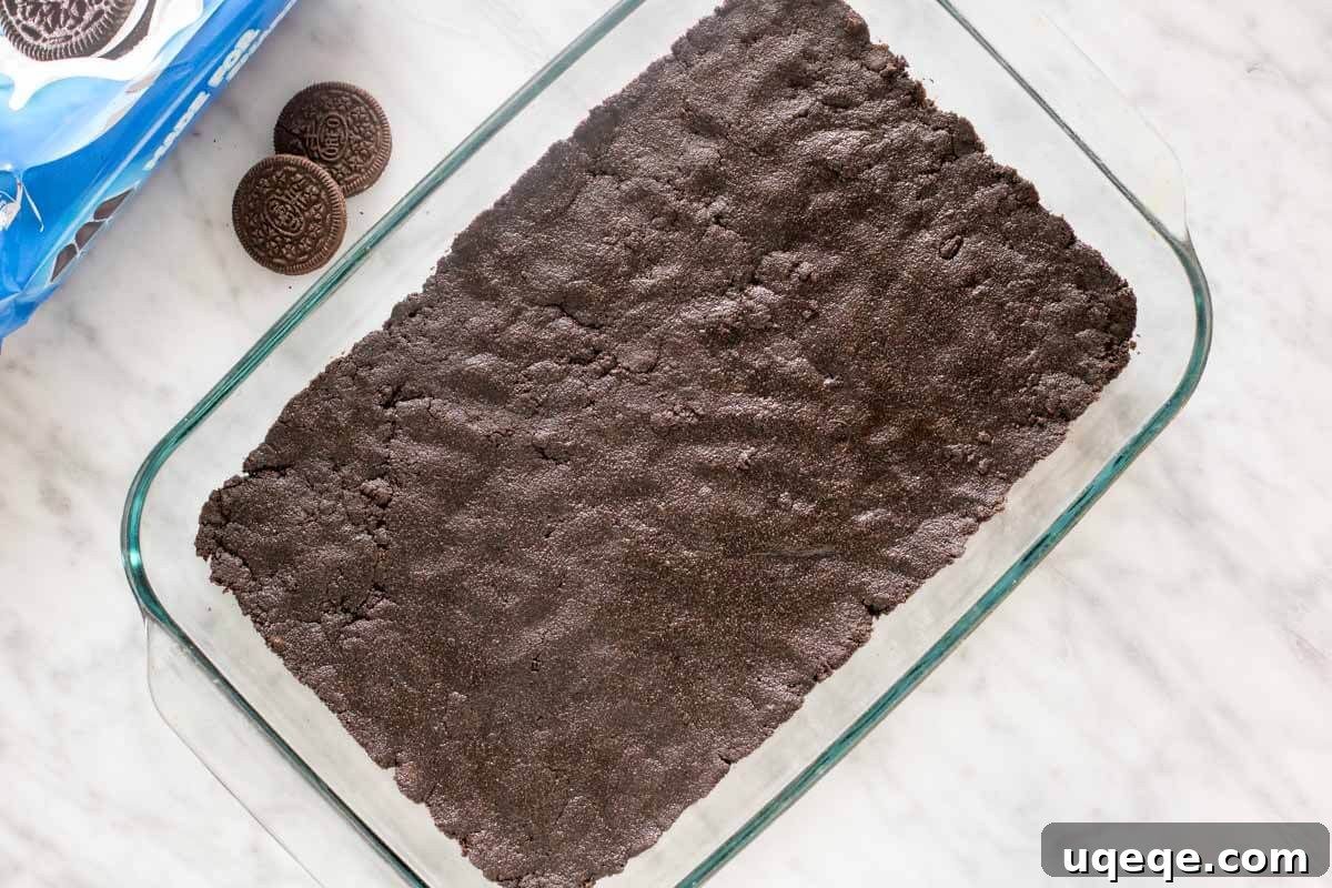 Oreo cookie crust in a 9x13 inch pan.