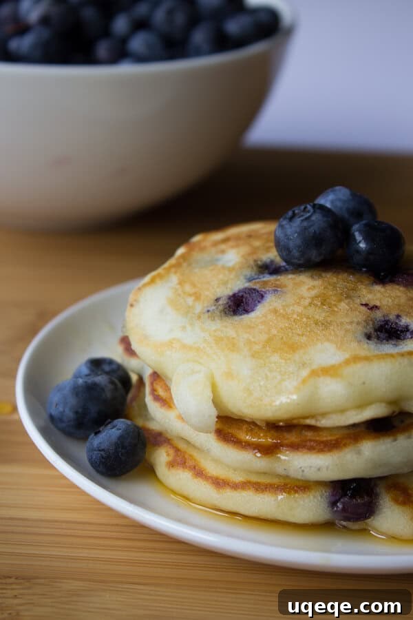 Fluffy Blueberry Buttermilk Stacks 2 Deliciously light and fluffy Blueberry Buttermilk Pancakes, better than any mix. Find the recipe at justsotasty.com