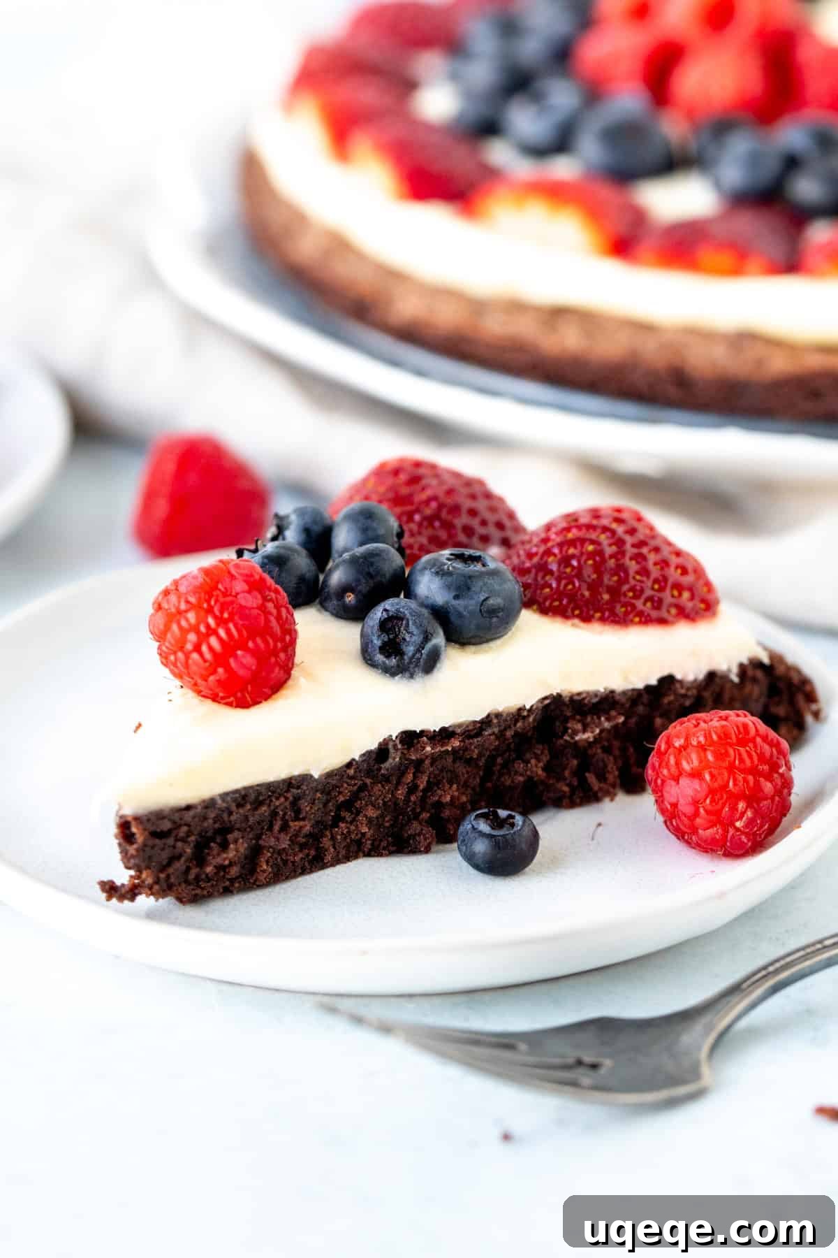 Fudge Brownie Fruit Pizza 3 Triangle of brownie topped with cream cheese frosting and fresh berries