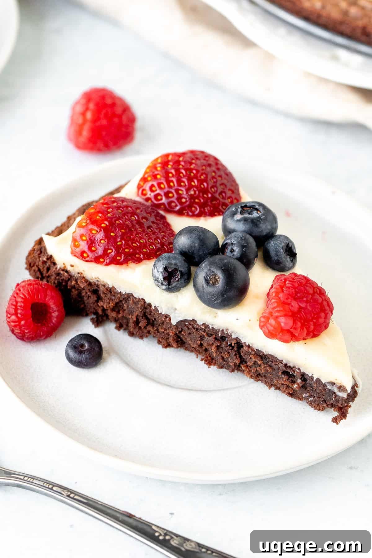Fudge Brownie Fruit Pizza 7 This brownie fruit pizza starts with a fudgy, chewy brownie as your pizza base. Then there's a layer of tangy cream cheese frosting, and tons of fresh berries. The perfect fruit pizza for anyone who loves brownies! #Browniefruitpizza #fruitpizza #chocolatefruitpizza from Just So Tasty