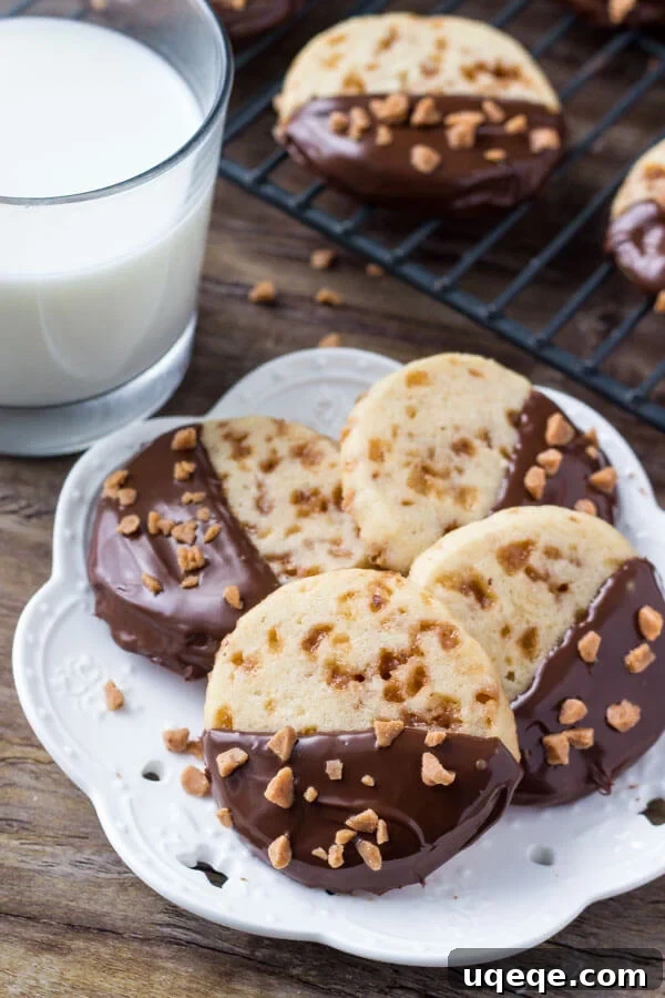 Golden Toffee Icebox Cookies 3 Soft, buttery, melt-in-your-mouth sugar cookies with golden edges. Filled with toffee pieces & dipped in chocolate - these toffee icebox cookies are just that incredible.