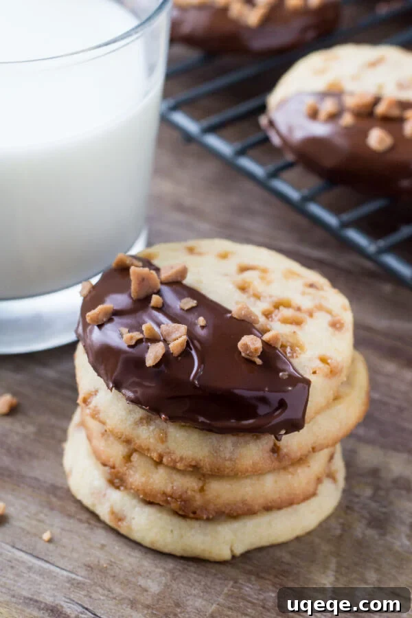 Golden Toffee Icebox Cookies 4 Soft, buttery, melt-in-your-mouth sugar cookies with golden edges. Filled with toffee pieces & dipped in chocolate - these toffee icebox cookies are just that incredible.