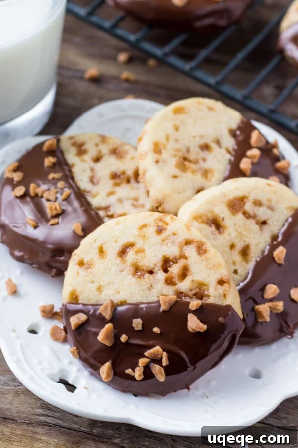 Golden Toffee Icebox Cookies 6 Soft, buttery, melt-in-your-mouth sugar cookies with golden edges. Filled with toffee pieces & dipped in chocolate - these toffee icebox cookies are just that incredible.