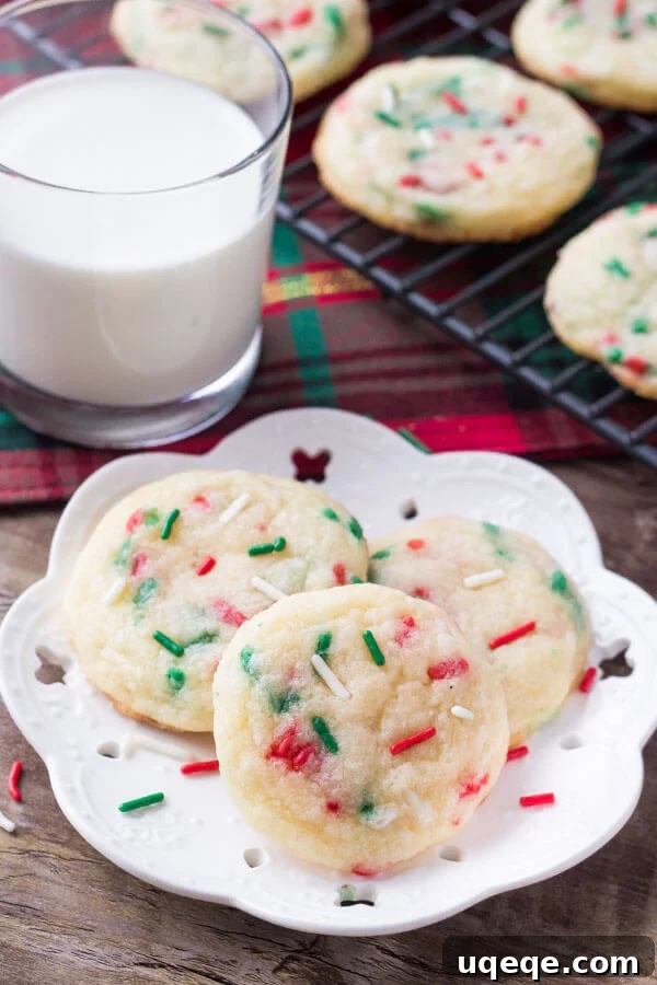 Joyful Confetti Cookies 3 Close-up of a stack of freshly baked Holiday Sprinkle Cookies, showing their soft texture and colorful sprinkles, ready for sharing.