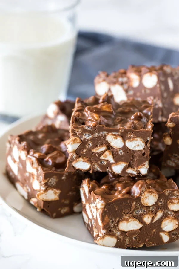 A plate of no bake rocky road bars with marshmallows and Rice Krispies