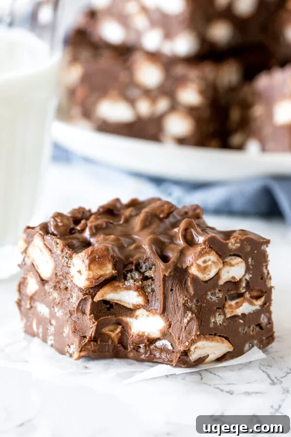 Effortless Rocky Road Delights 5 A chewy rocky road bar with a bite taken out of it to show the gooey texture.