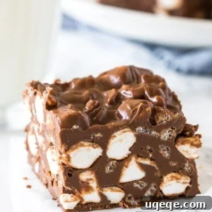 A no bake rocky road bar with a glass of milk