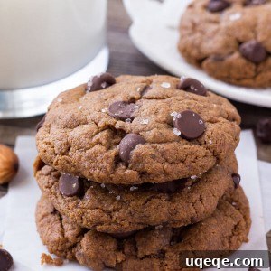 Decadent Almond Butter Chocolate Chip Cookies 6 A stack of three gluten free almond butter cookies with dark chocolate chips.