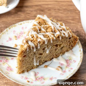 Slice of banana coffee cake with drizzle of glaze