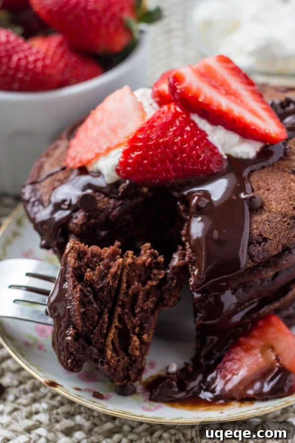 Decadent Chocolate Pancakes 7 A stack of fluffy chocolate pancakes drizzled with chocolate ganache