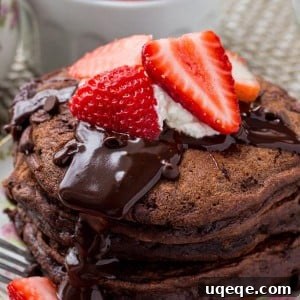 Decadent Chocolate Pancakes 8 A stack of fluffy chocolate pancakes with chocolate ganache, strawberries and whipped cream is the ultimate breakfast for chocolate lovers.