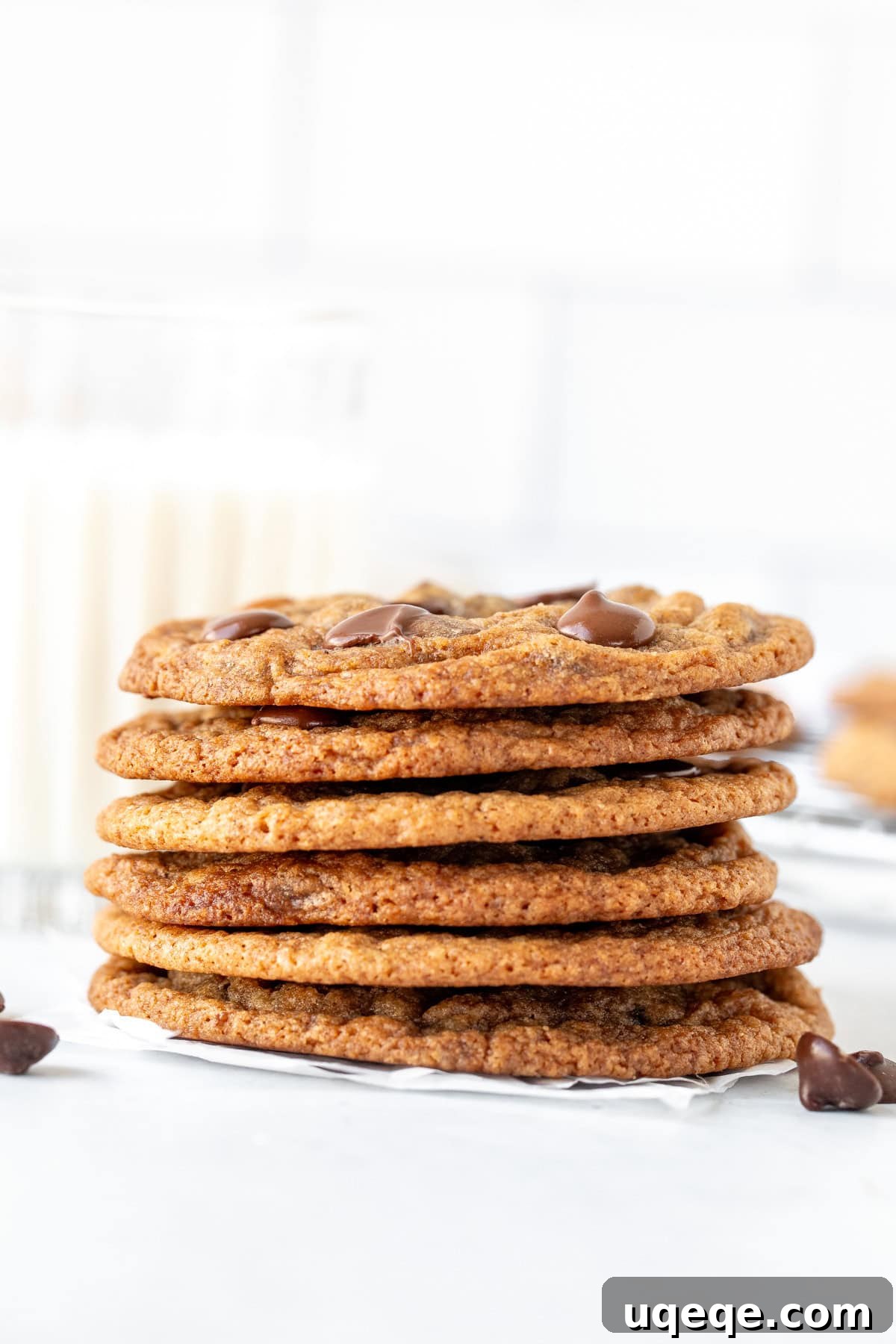 Banana Bliss Choc-Chip Cookies 3 A tempting stack of freshly baked banana chocolate chip cookies next to a tall glass of milk