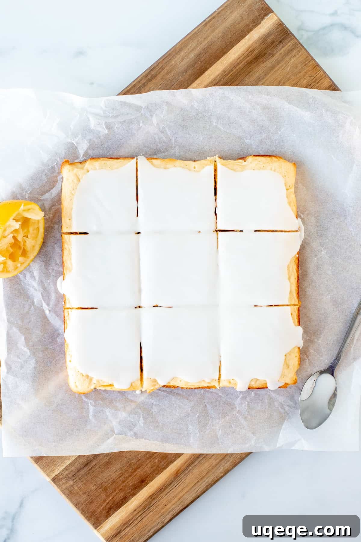 Zesty Lemon Blondies 6 Nine glazed lemon blondies neatly arranged on a cutting board
