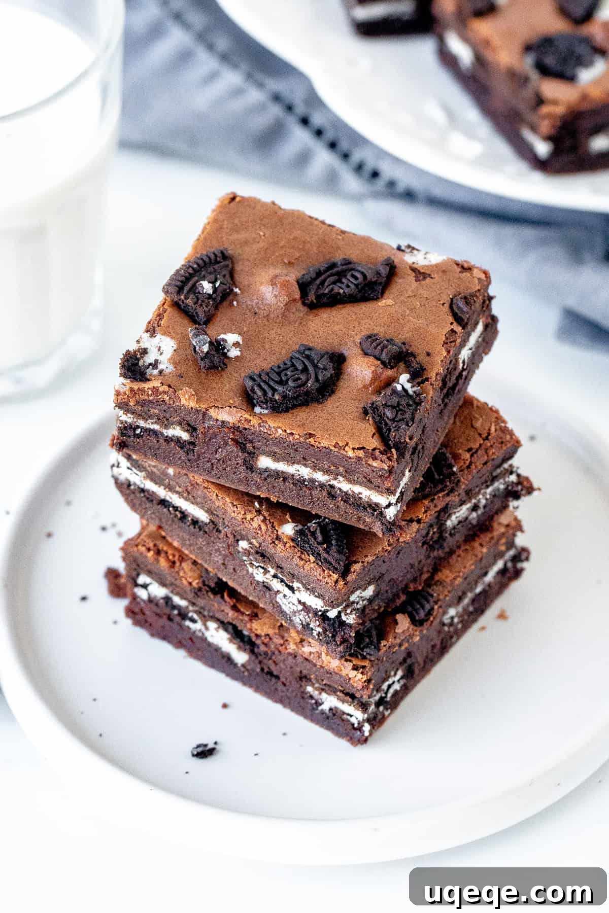 Plate of Oreo brownies with glass of milk