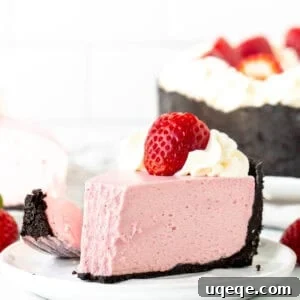 Slice of no bake strawberry flavored cheesecake