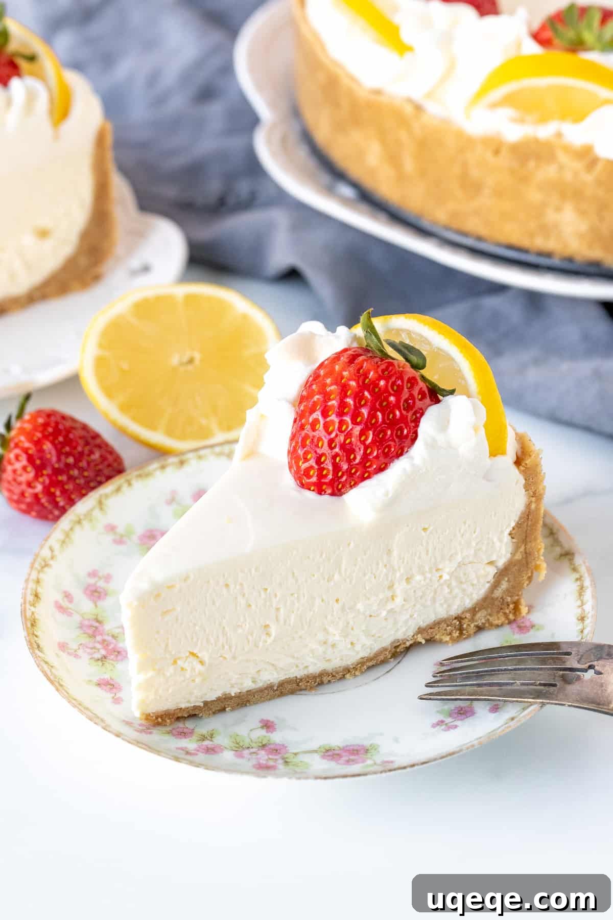 Sunshine Lemon No Bake Treat 2 A perfectly sliced piece of no-bake lemon cheesecake with a golden graham cracker crust and a pale yellow, creamy filling, ready to be enjoyed.