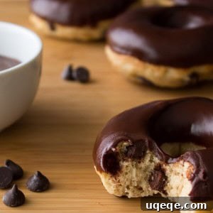 Chocolate Chip Doughnuts. Cake doughnuts baked in a doughnut pan, filled with chocolate chips & dipped in chocolate glaze - Say hello to your new favorite breakfast!