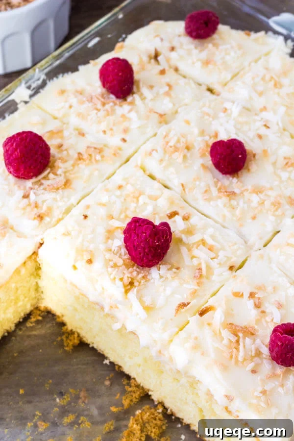 Homemade coconut cake with coconut frosting -moist, tender and filled with coconut. 