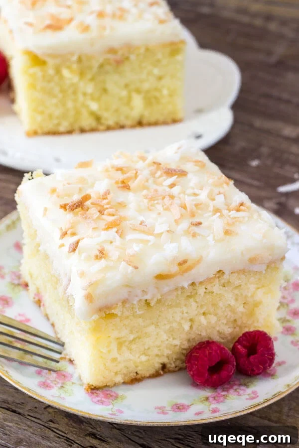 Easy coconut cake with coconut frosting. This recipe is extra moist and infused with real coconut flavor. 
