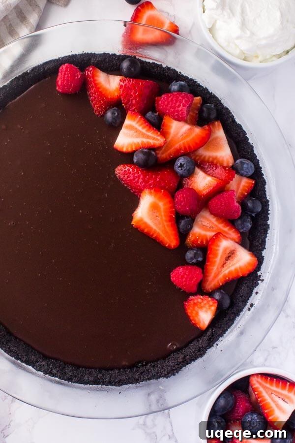 No bake chocolate pie with a rich, fudgy chocolate ganache filling and a classic Oreo cookie crust.