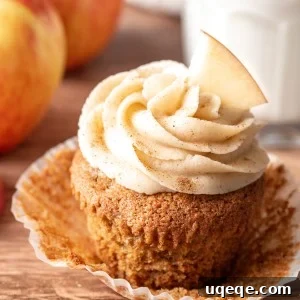 Apple cupcake with cinnamon cream cheese frosting and paper removed