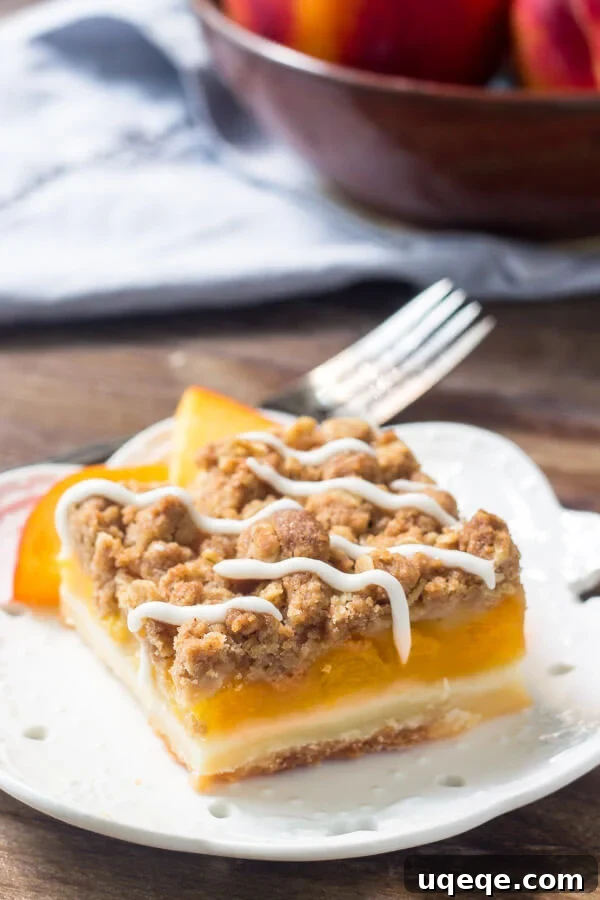Peachy Crumble Bars 6 Multiple Peach Pie Crumb Bars stacked on a white plate, showcasing their rustic texture, golden crumble, and thick peach filling.