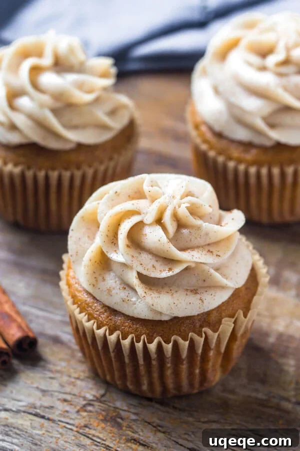 Moist pumpkin spice cupcakes topped with fluffy cinnamon cream cheese frosting.