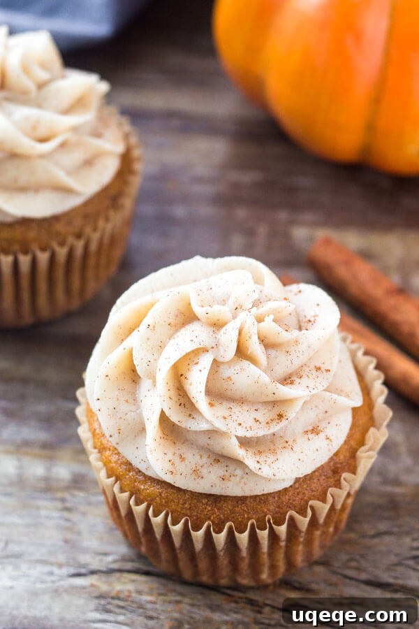 Detailed image of a perfectly baked pumpkin cupcake, showcasing its moist texture and rich pumpkin spice flavor before frosting.