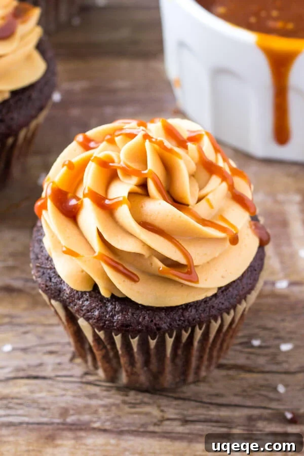 Decadent Chocolate Caramel Cupcakes 2 Rich chocolate cupcakes with fluffy salted caramel frosting and a caramel drizzle.