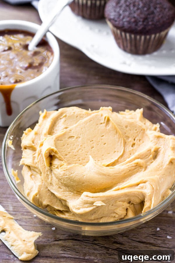Decadent Chocolate Caramel Cupcakes 5 A bowl filled with rich, creamy salted caramel frosting, ready to adorn chocolate cupcakes.