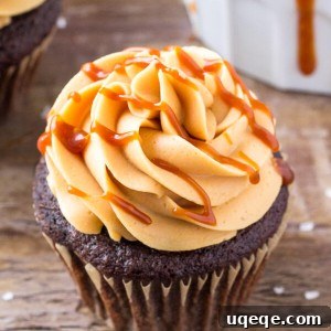 Chocolate cupcakes with caramel frosting are moist, tender and topped with caramel buttercream & a drizzle of salted caramel.