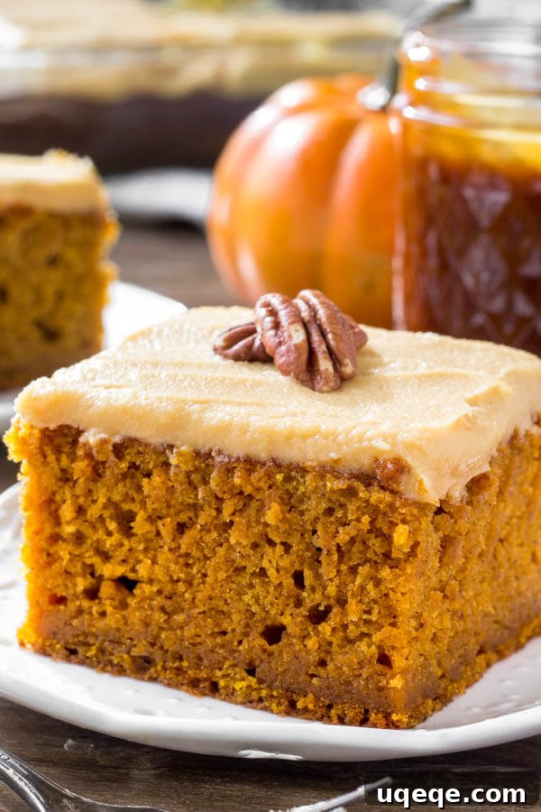 Decadent Pumpkin Caramel Cream Cheese Cake 5 A slice of moist pumpkin cake with caramel cream cheese frosting is the perfect dessert for fall or Thanksgiving.
