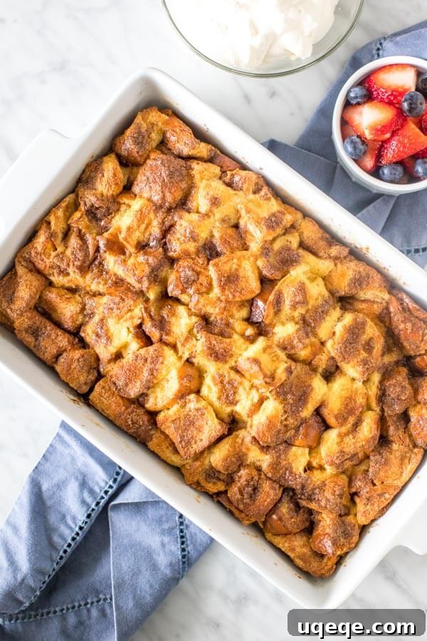 Overnight French Toast Bake 5 9x13 inch casserole pan of French toast casserole, golden brown and puffed up.