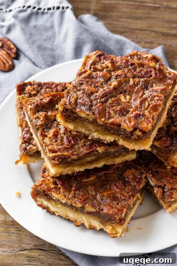 Decadent Pecan Pie Squares 4 A plate of pecan pie bars.
