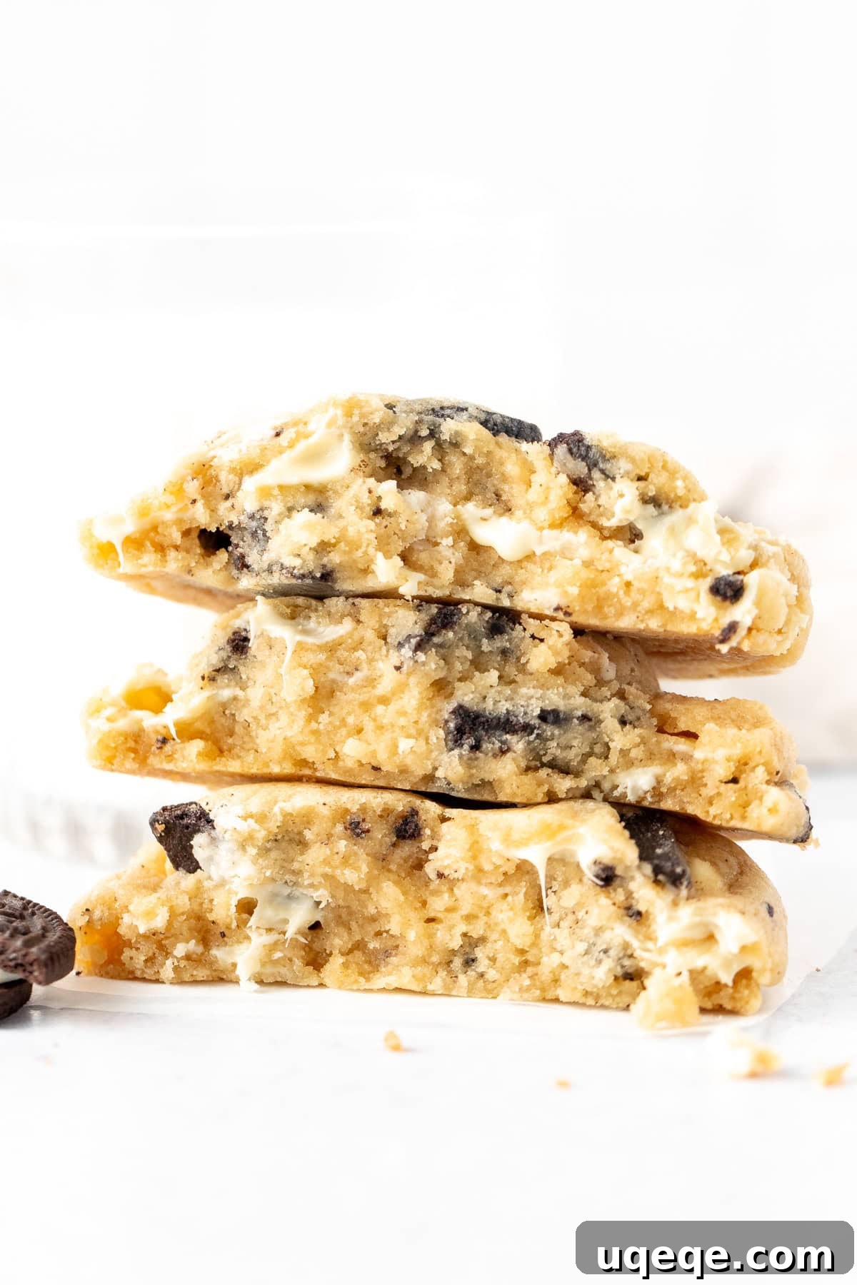 Gourmet Cookies and Cream 2 Stack of cookies and cream cookies, broken in half, revealing gooey interior