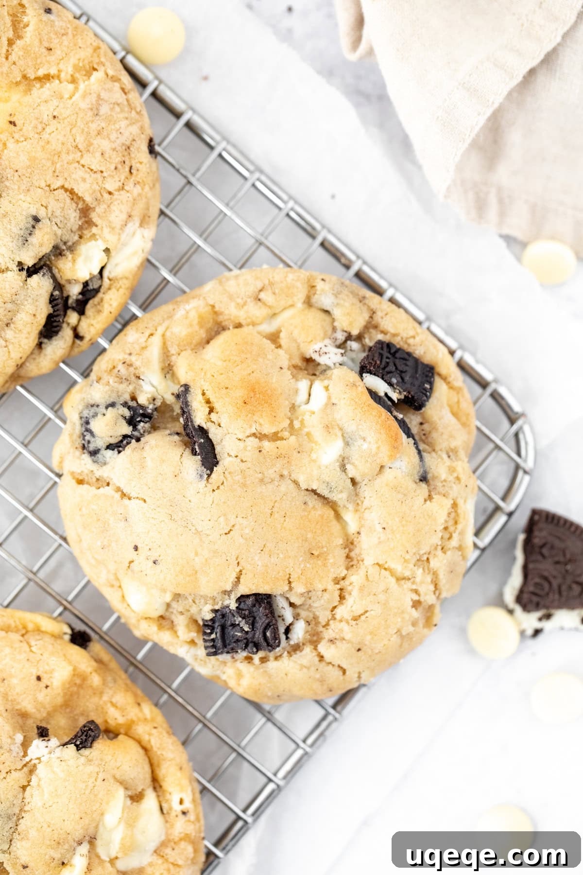 Gourmet Cookies and Cream 3 Bakery-style cookies and cream cookies, cooling on a wire rack, perfectly round and thick