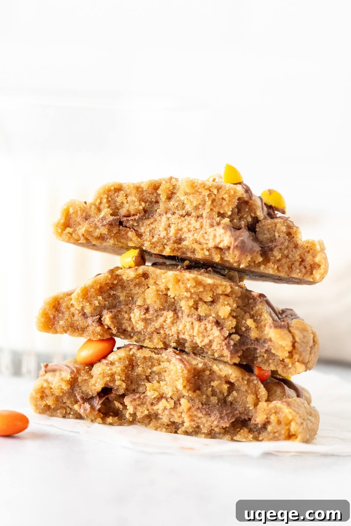 Reese's Peanut Butter Explosion Cookies 2 Stack of Reese's stuffed peanut butter cookies, broken in half revealing the gooey Reese's peanut butter cup center