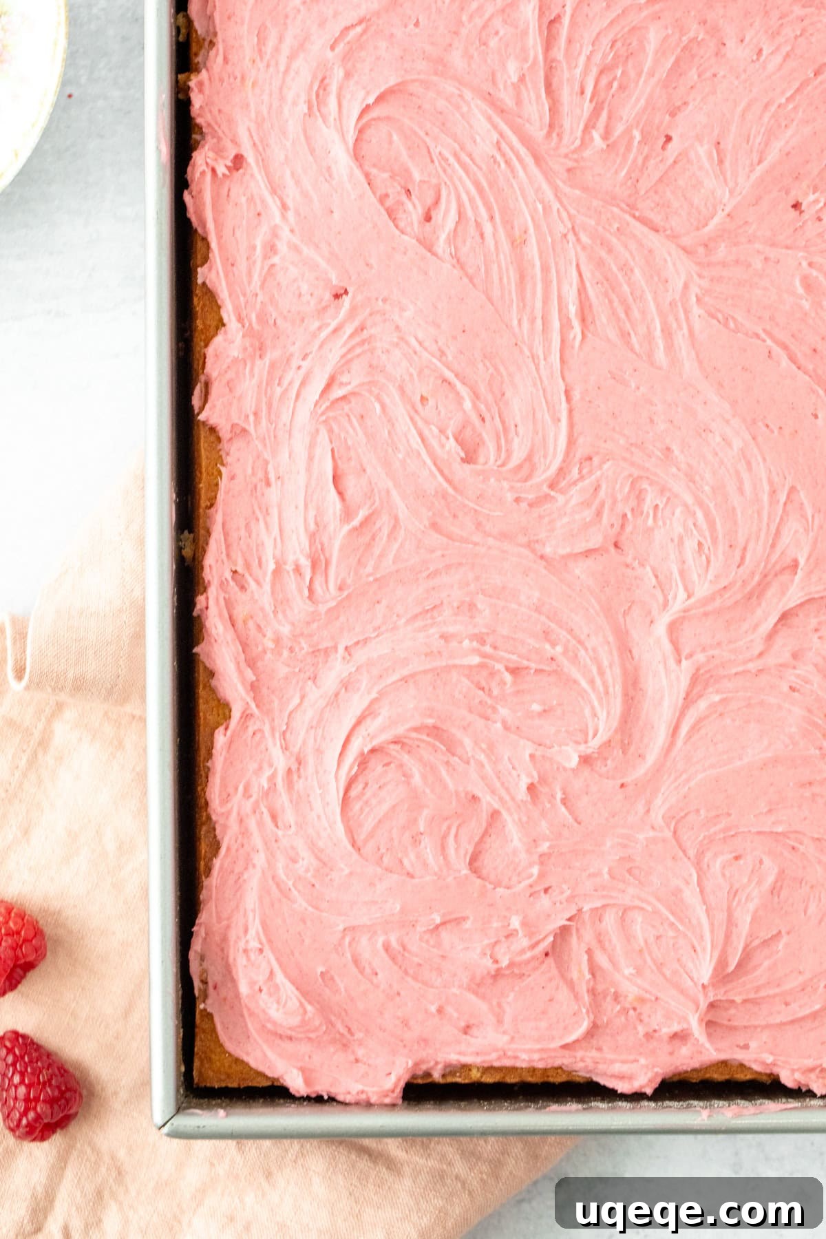 Raspberry Topped Almond Delight 3 Sheet cake generously covered with pink raspberry frosting