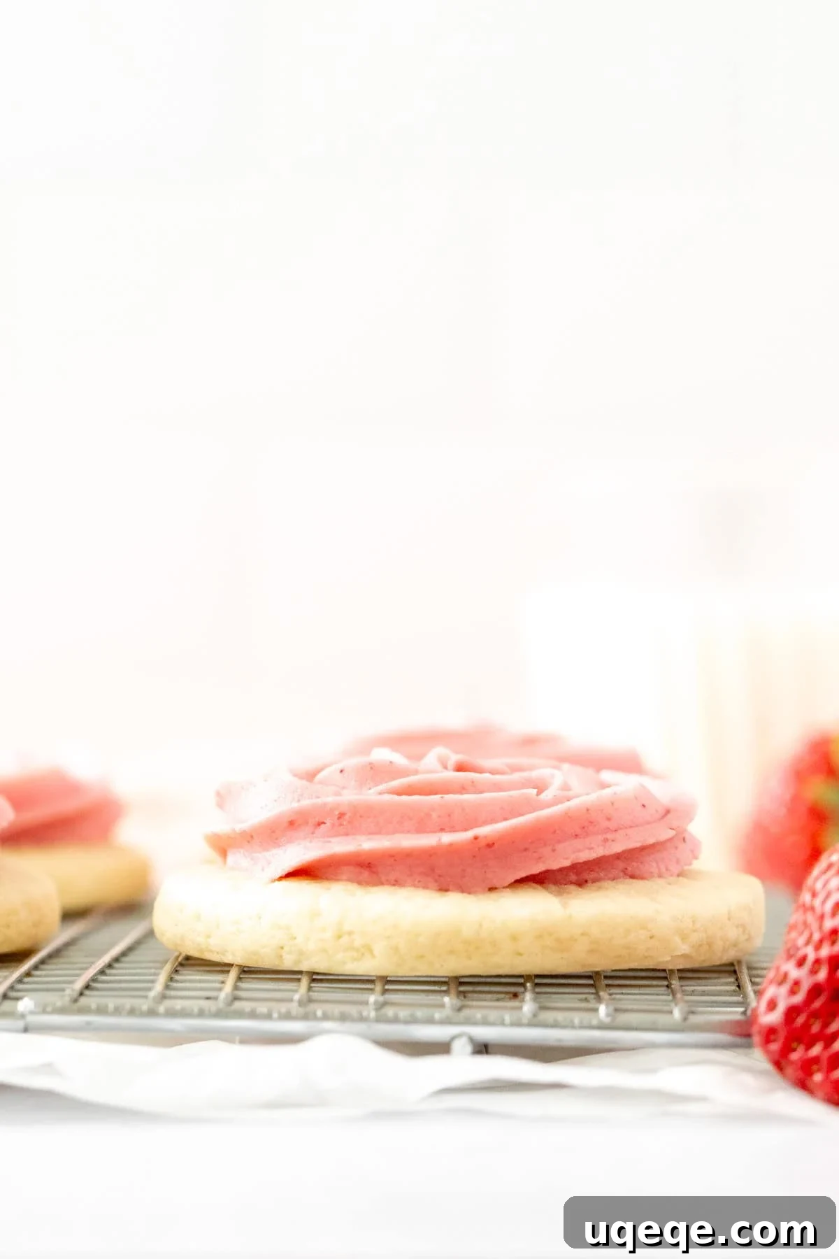 Strawberry Frosted Sugar Cookies Recipe — Soft, Iced Treats 3 Cakey sugar cookie piped with strawberry buttercream frosting