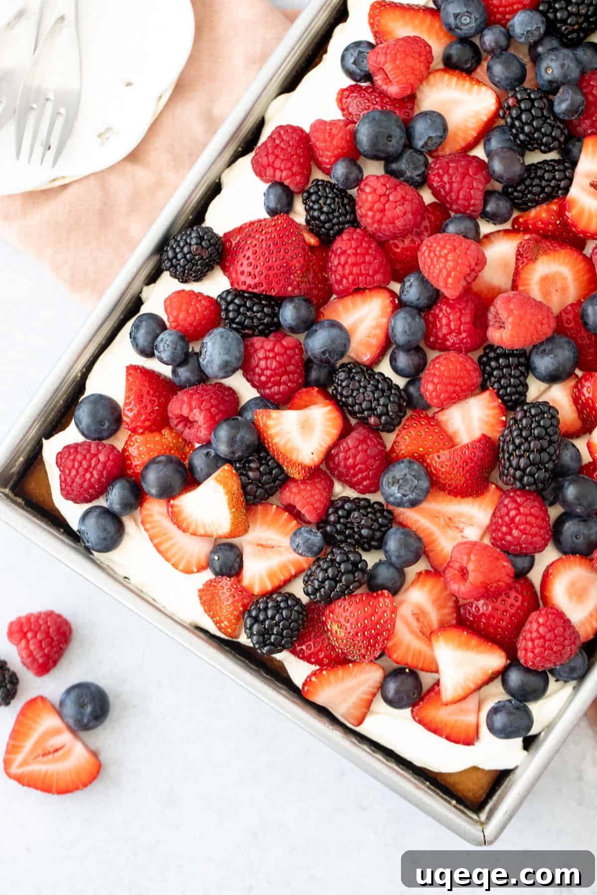 Berries and Cream Sheet Cake Recipe — Light Berry Dessert for Gatherings 3 9x13 inch pan of sheet cake topped with whipped cream topping and berries
